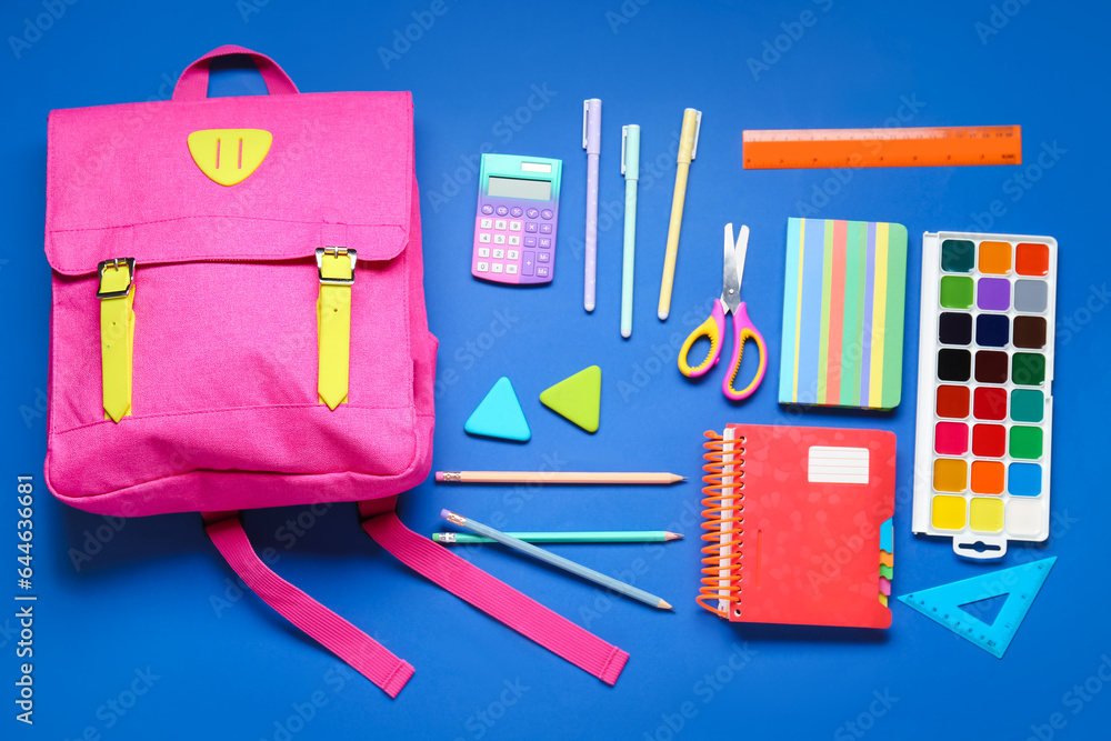 Composition with stylish school backpack and different stationery on blue background