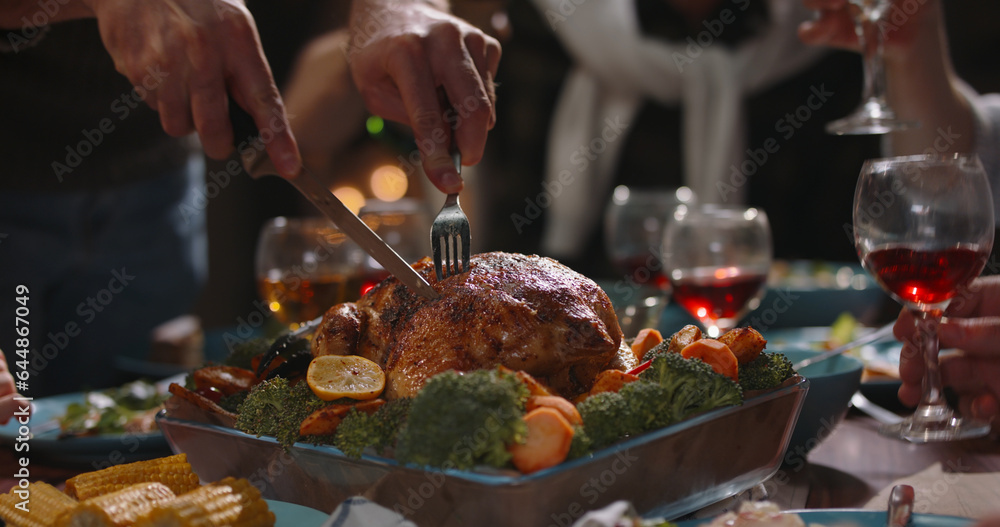 Close up shot of people eating delicious roasted turkey during thanksgiving or christmas dinner part