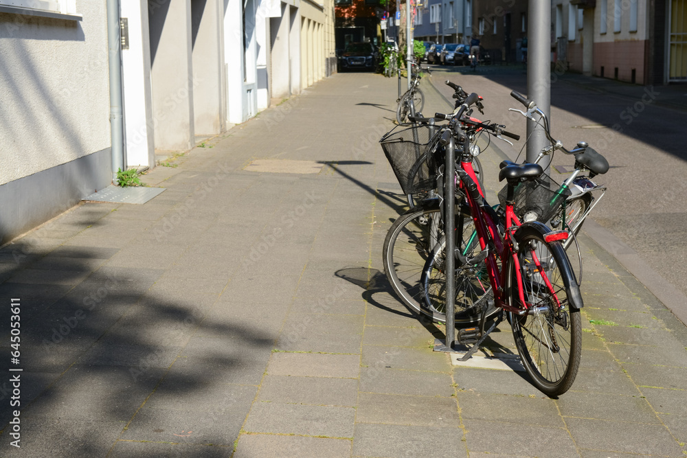 Modern bicycles parked on city street