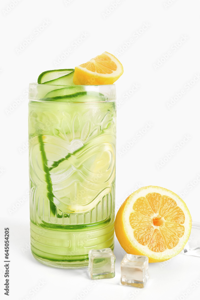 Glass of lemonade with cucumber on white background