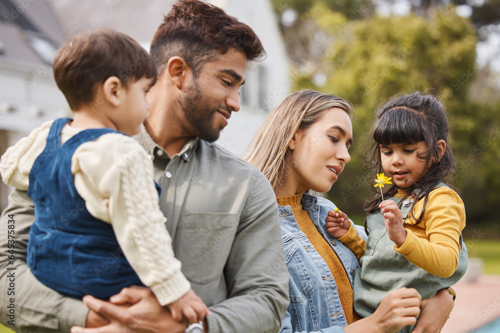 Mother, father and children outdoor with a flower in spring with love, care and security. A man, wom