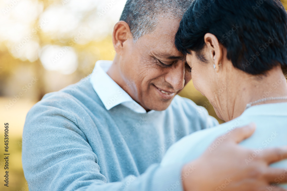 Happy, connection and senior couple hugging in a park on an outdoor date for romance, bonding or lov