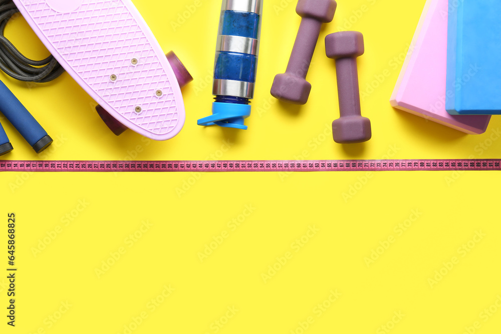 Composition with different sports equipment and measuring tape on yellow background