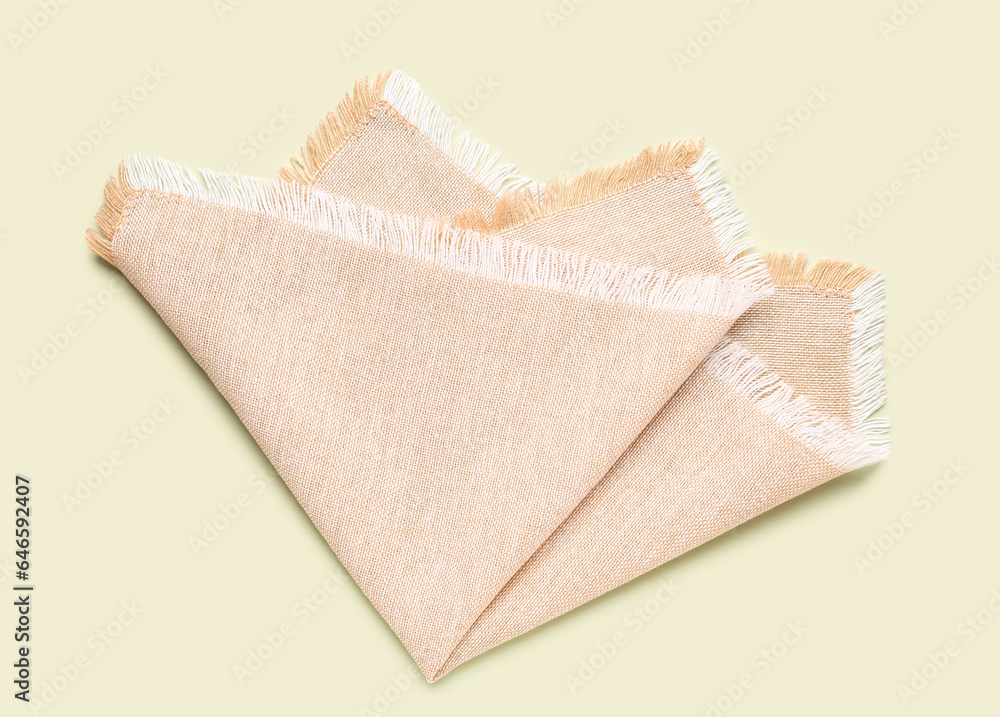 Clean folded napkin on color background