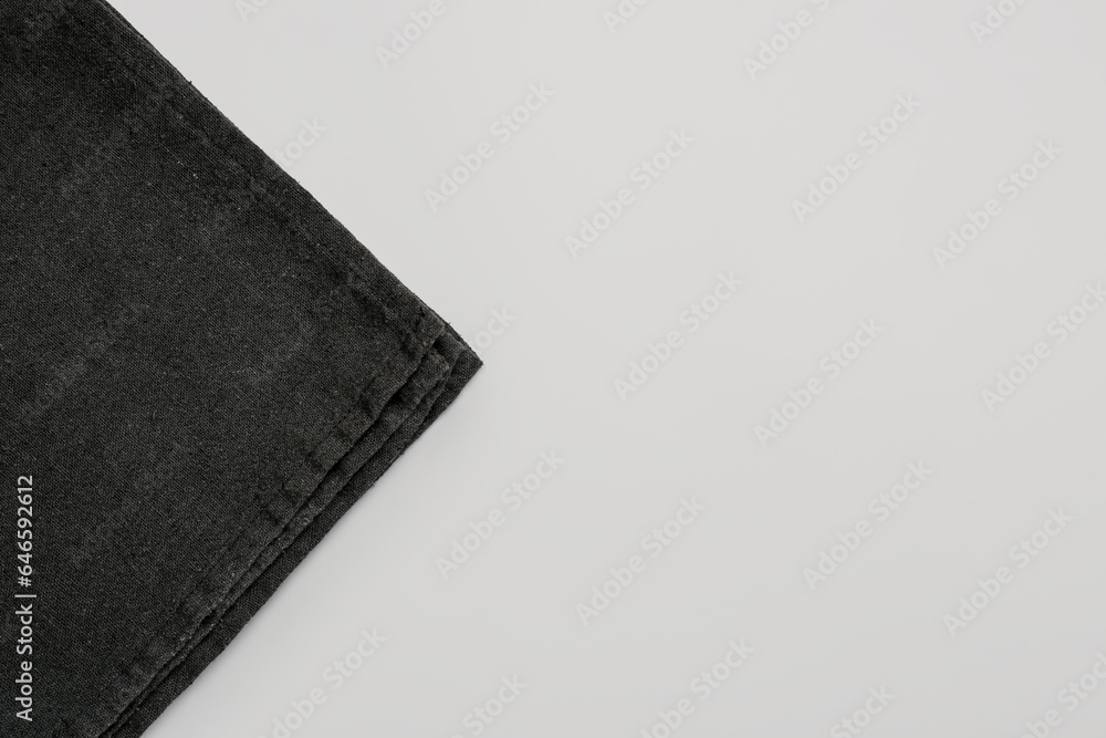 Black napkin on grey background