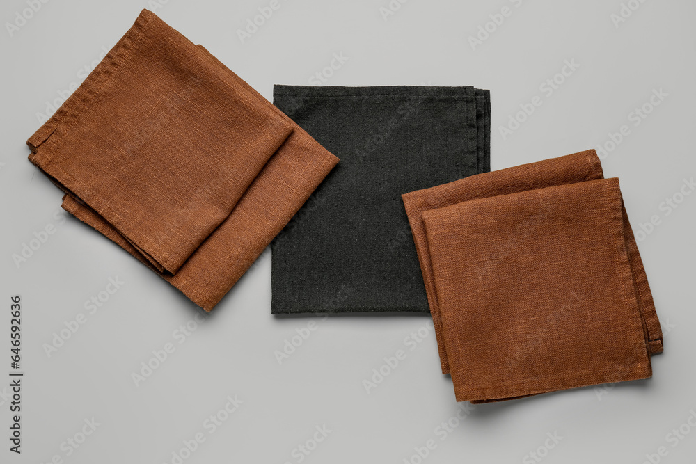 Set of cotton napkins on grey background