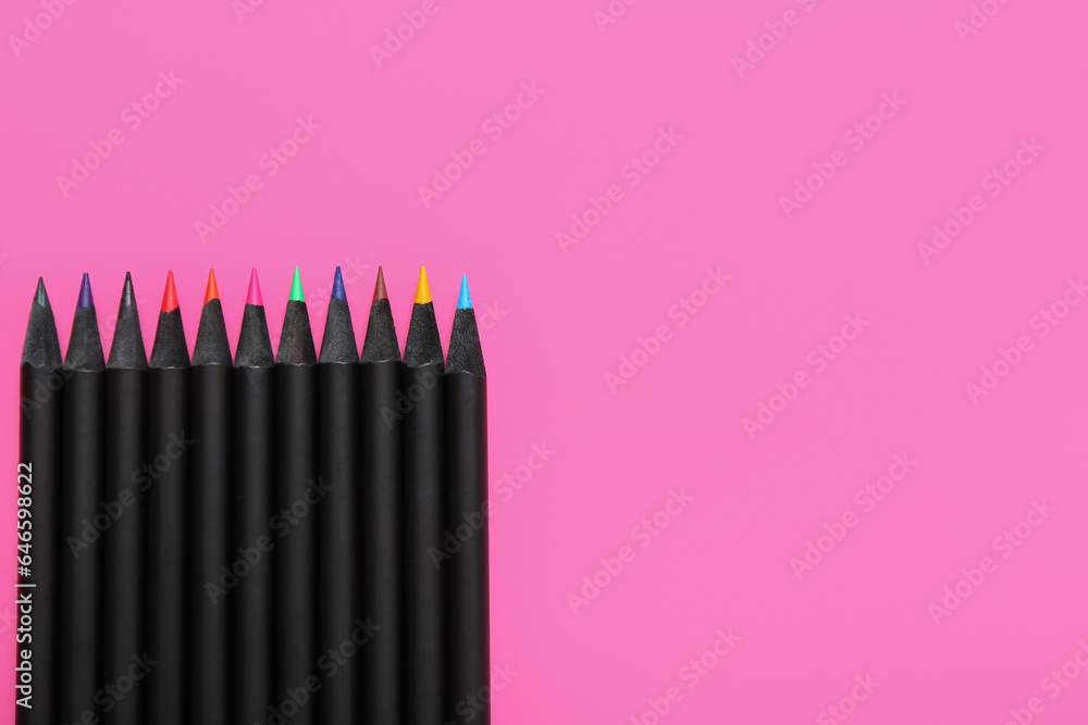 Set of colorful pencils on pink background