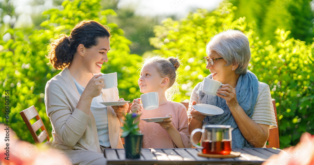 family drinking tea in the garden