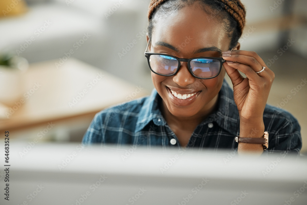 Face, smile and computer with a black woman in glasses working closeup in her home for remote employ