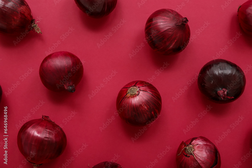 Fresh red onions on color background