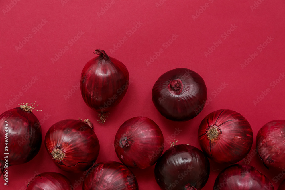 Fresh red onions on color background