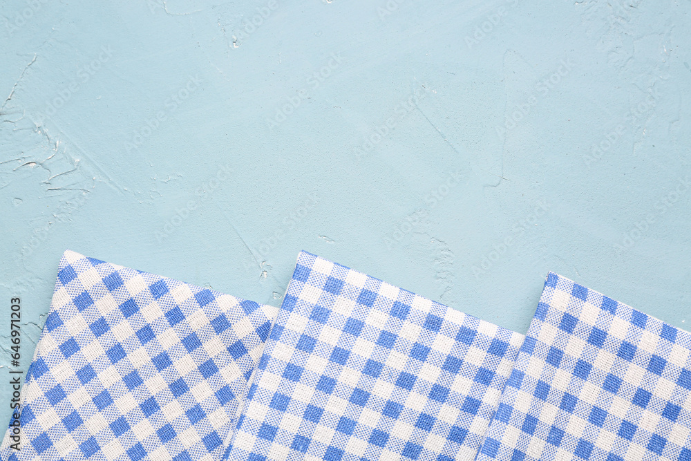 Clean folded napkins on color background