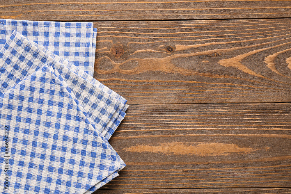 Set of clean napkins on wooden background