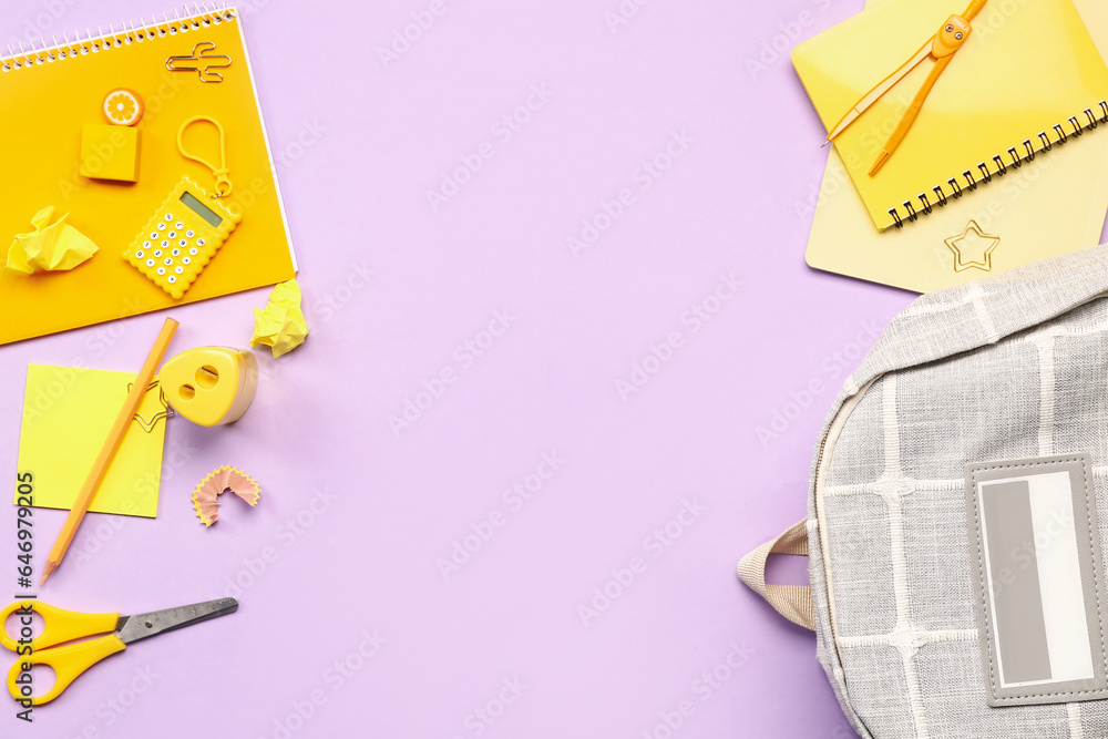 Stylish school backpack with different stationery supplies on lilac background