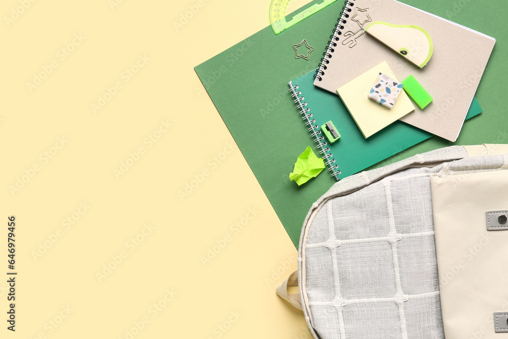 Stylish school backpack with different stationery supplies on colorful background