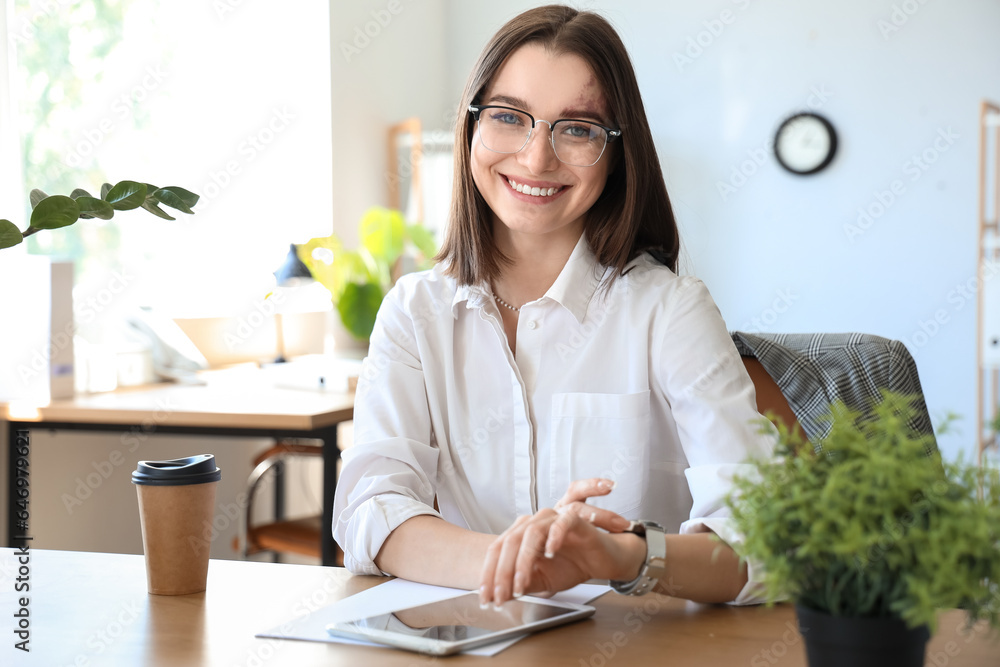 Young businesswoman working in office