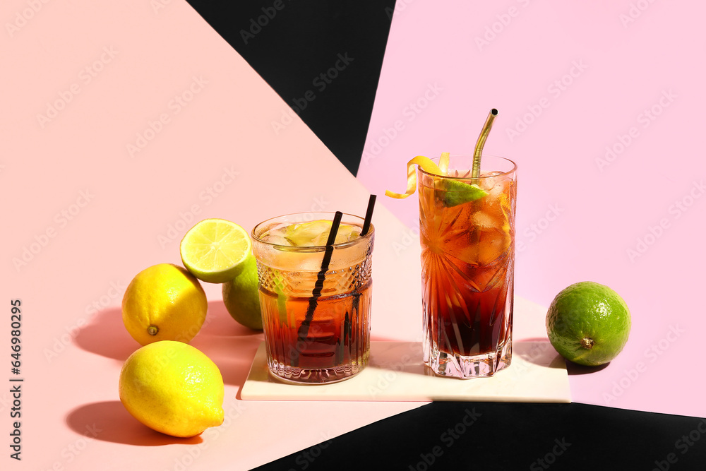 Glasses of cold Long Island iced tea on color background