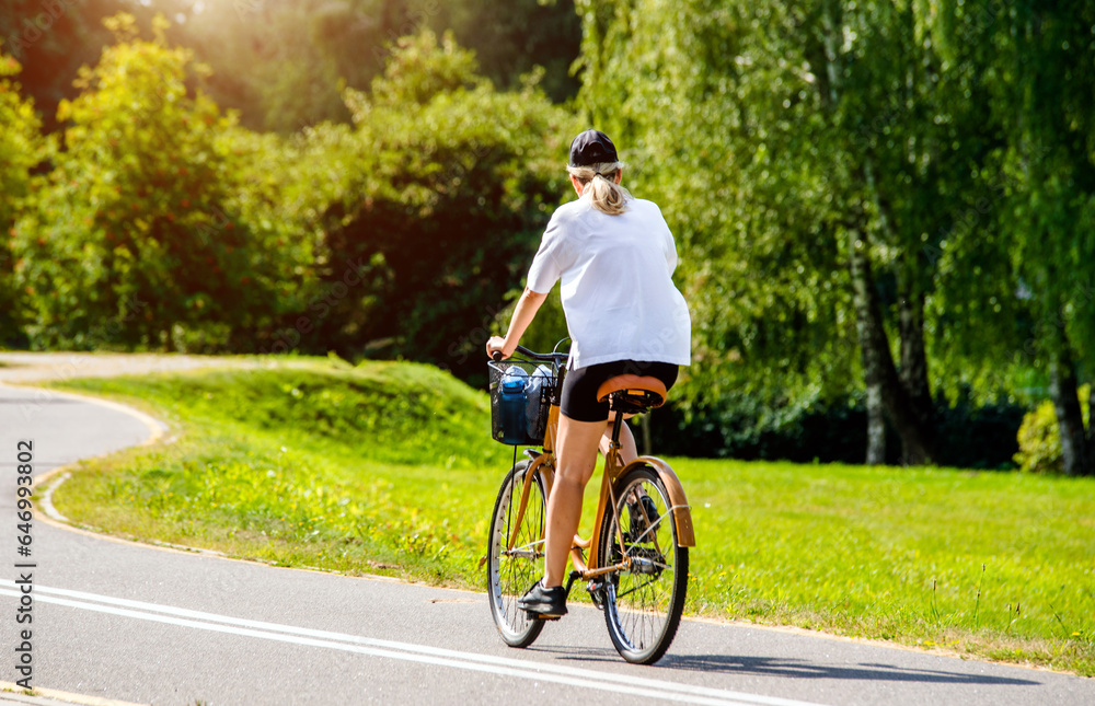 Cyclist ride on the bike path in the city Park 