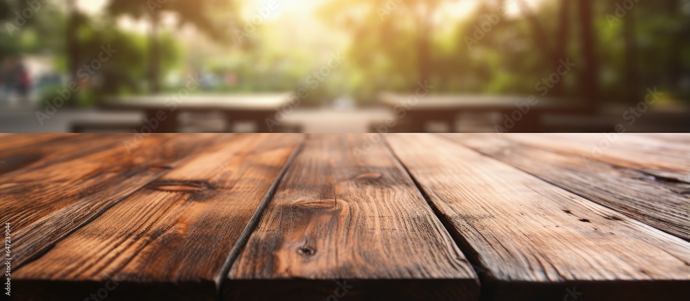 Blurred backdrop emphasizes wooden table in close up