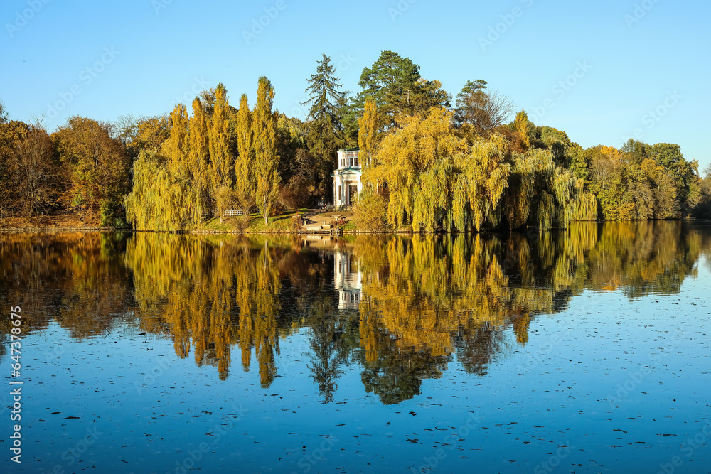 View of beautiful lake and yellow trees on autumn day