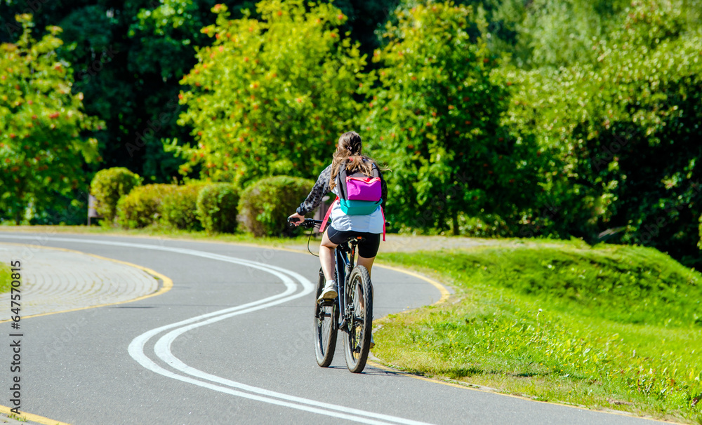 Cyclist ride on the bike path in the city Park 