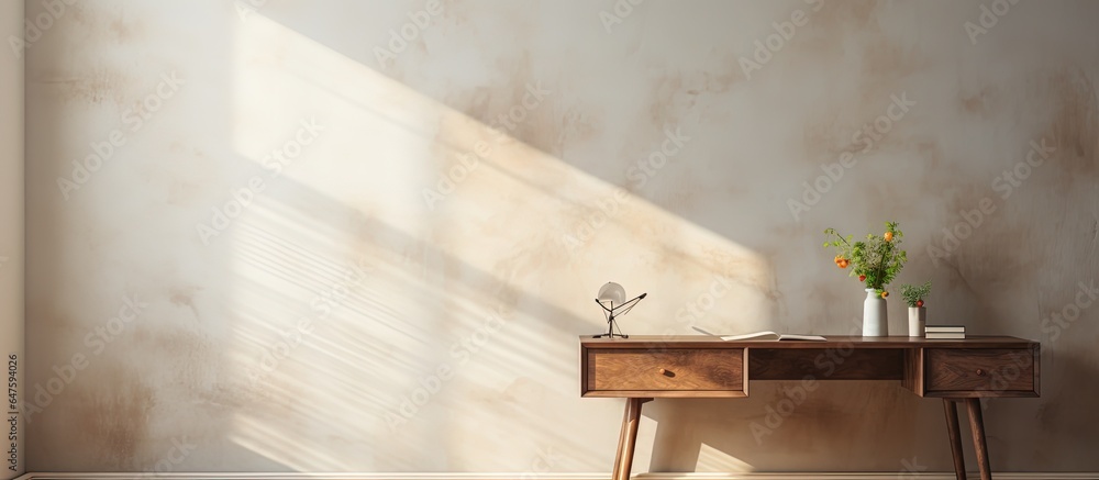 An unfurnished desk in a white corner with sunlight