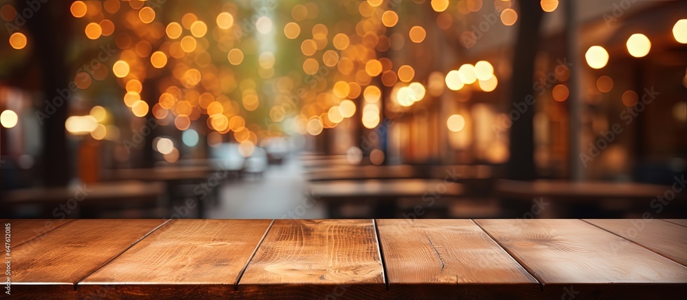 Blurry coffee shop background with wooden table in focus