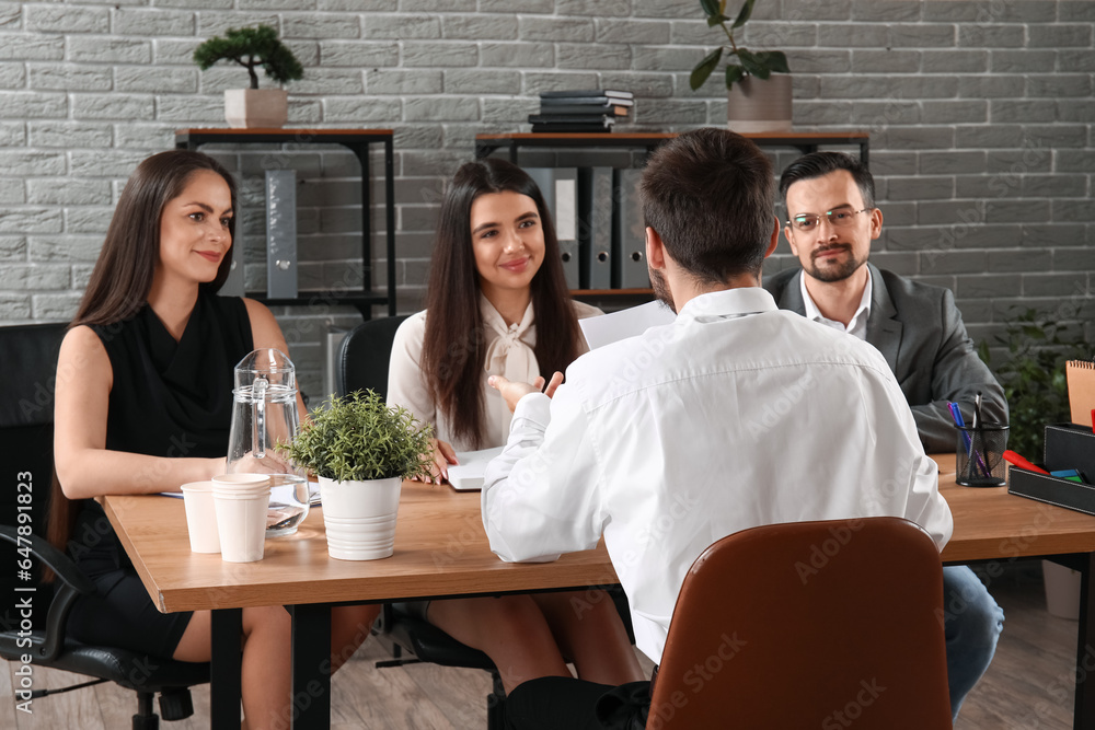 Human resources commission interviewing male applicant in office