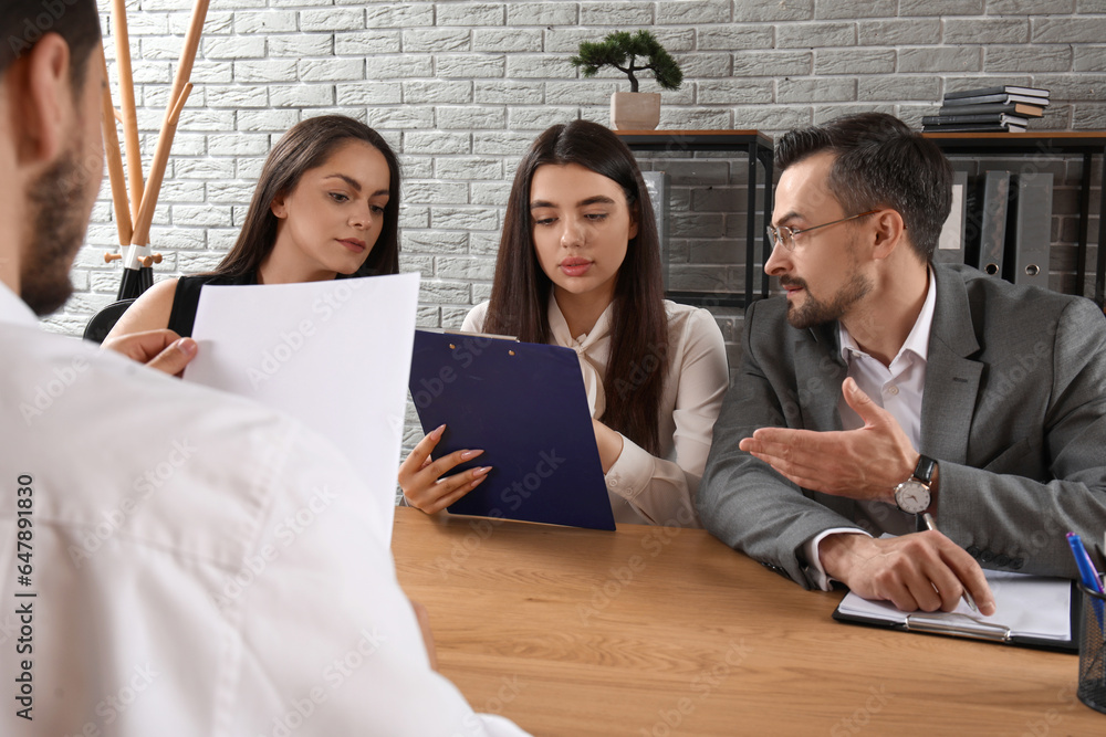 Human resources commission interviewing male applicant in office