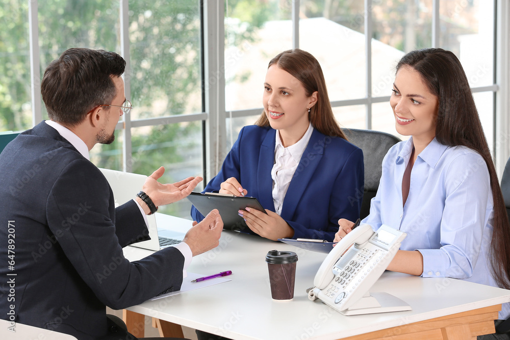 Human resources commission interviewing male applicant in office