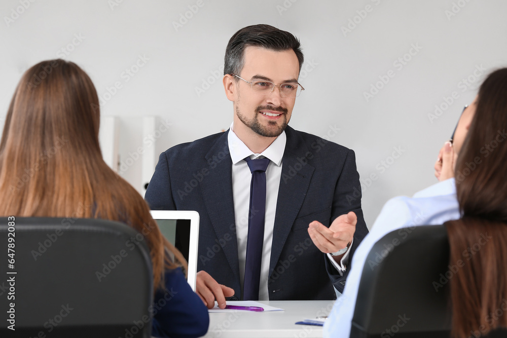 Human resources commission interviewing male applicant in office