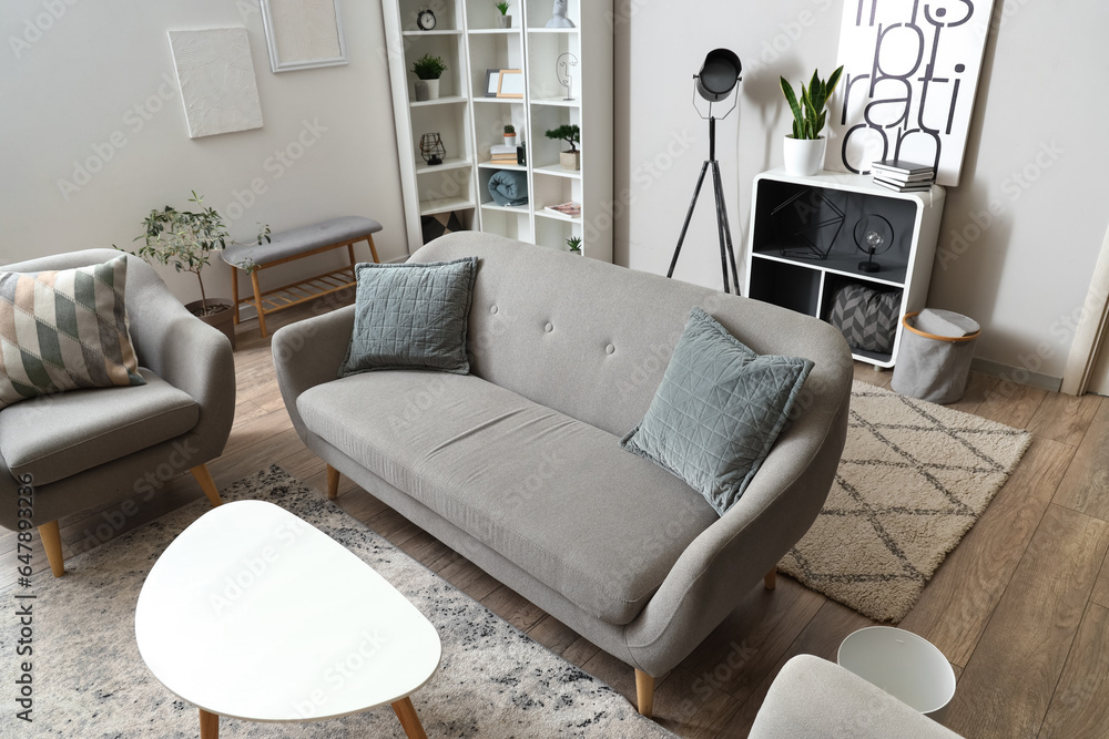 Interior of light living room with sofa and coffee table