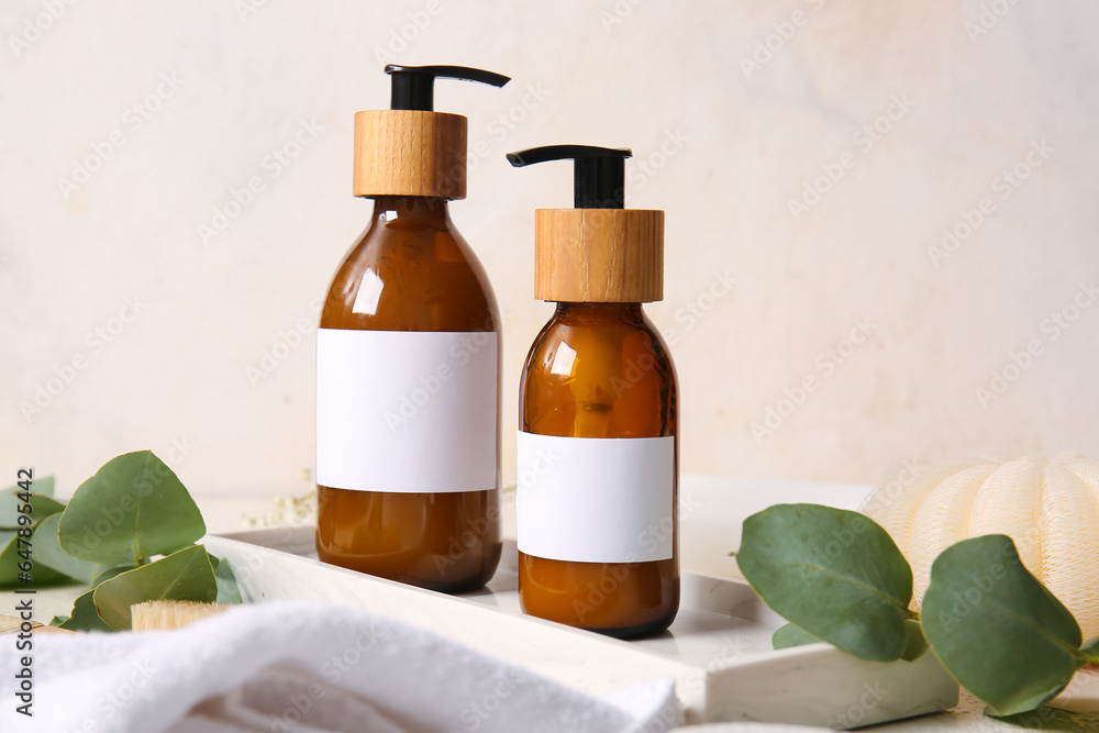 Bottles of shampoo on white background