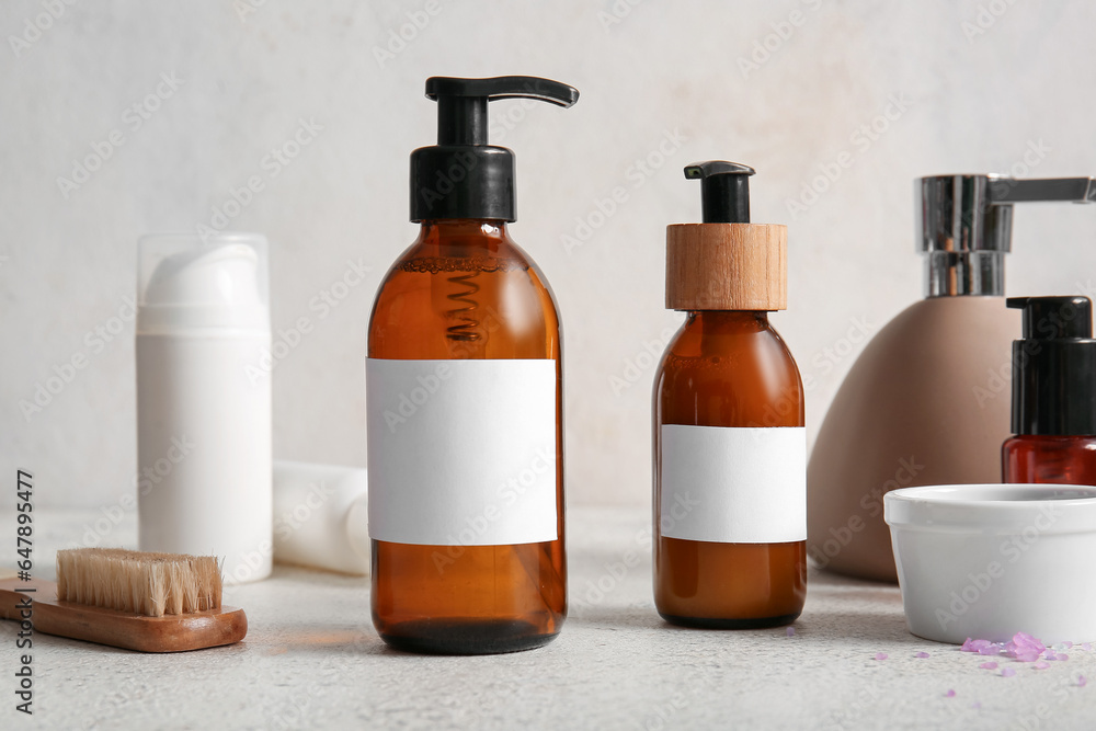 Bottles of shampoo on white background