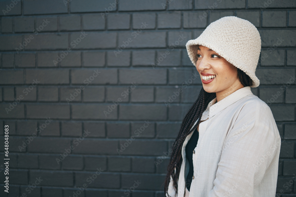 Brick wall, fashion and face of woman in city with trendy clothes, accessories and style with smile. Happy, fun and person on gray background outdoors for holiday, vacation and weekend in urban town