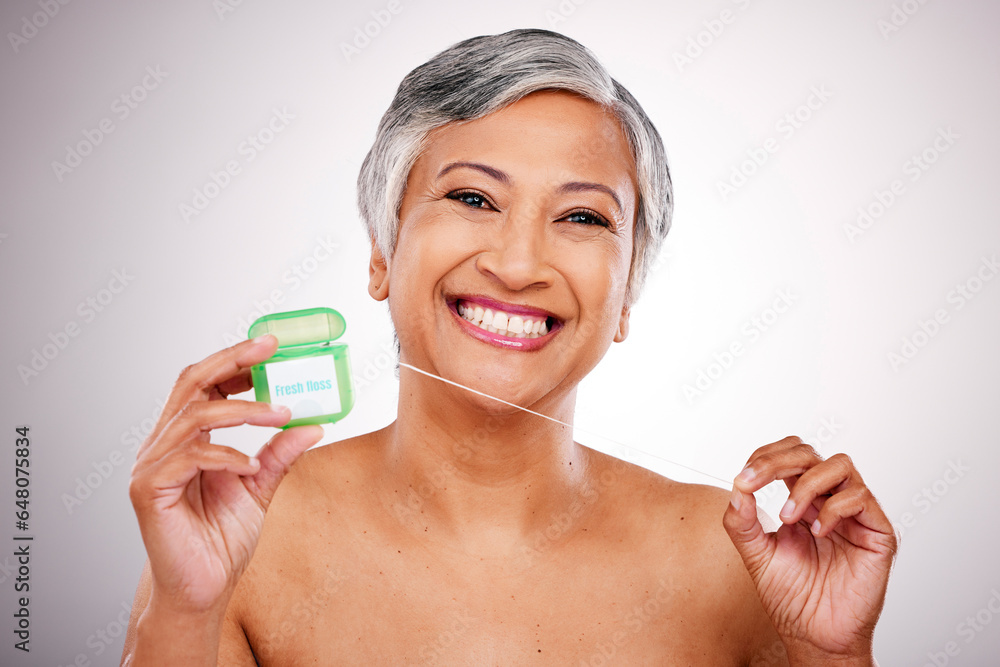 Senior woman, floss and studio portrait for transformation, beauty and healthy mouth by white background. Mature female model, teeth whitening and string for dental self care, cleaning and smile