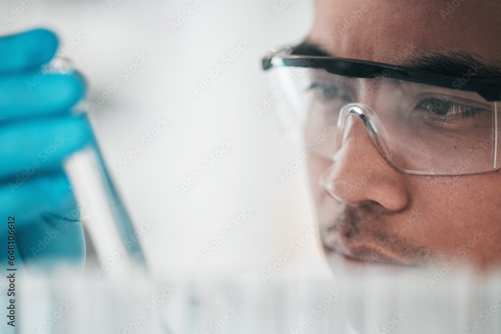 Science, research and man with glasses, test tube and biotech in laboratory, solution for vaccine or medical innovation. Healthcare, lab analytics and medicine, scientist in eco pharmaceutical study.