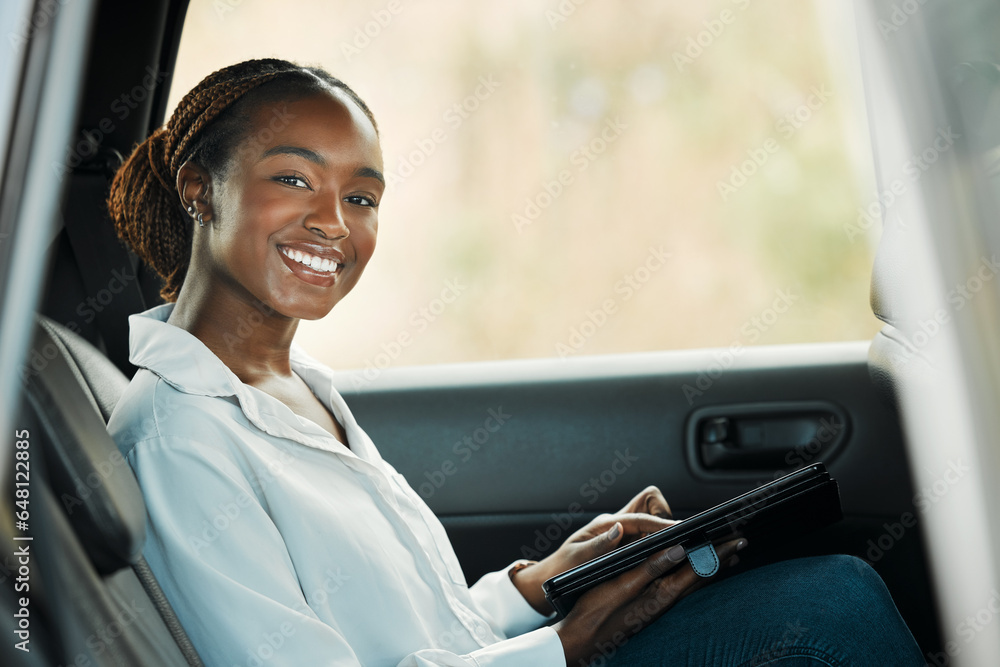 Portrait, tablet and a business black woman a taxi for transport or ride share on her commute to work. Smile, technology and a happy young employee in the backseat of a cab for travel as a passenger