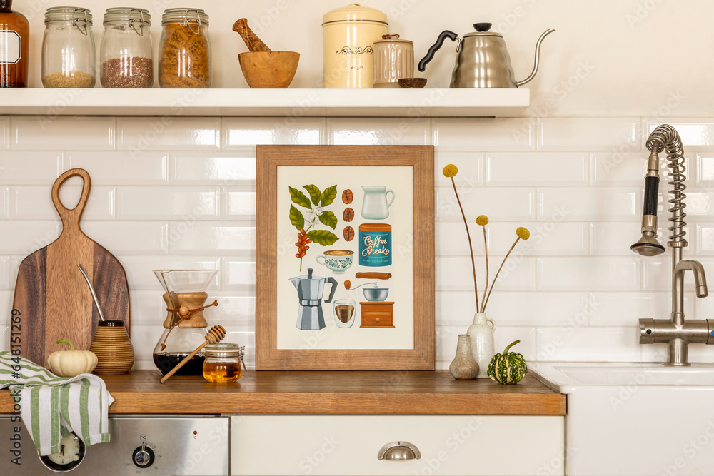 Creative composition of living room interior with mock up poster frame, vase with dried flowers, gray pitcher, jar with spices, bowl with vegetable and personal accessories. Home decor. Template.