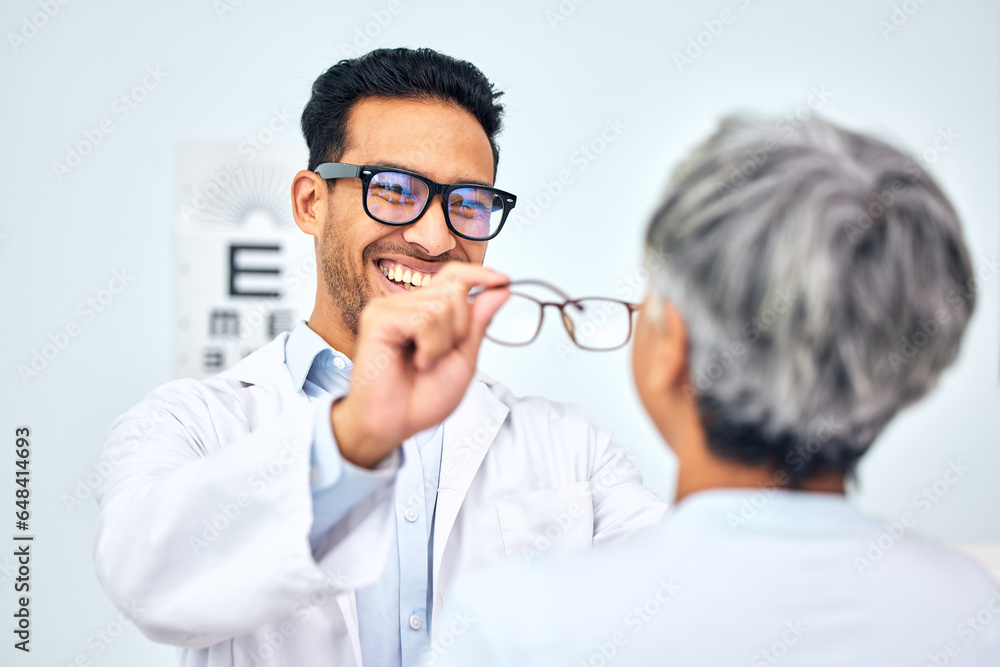 Glasses, optometrist and client with appointment, vision and consultation with diagnosis, smile and help. Office, employee and senior woman with eyewear, doctor and healthcare with wellness and frame