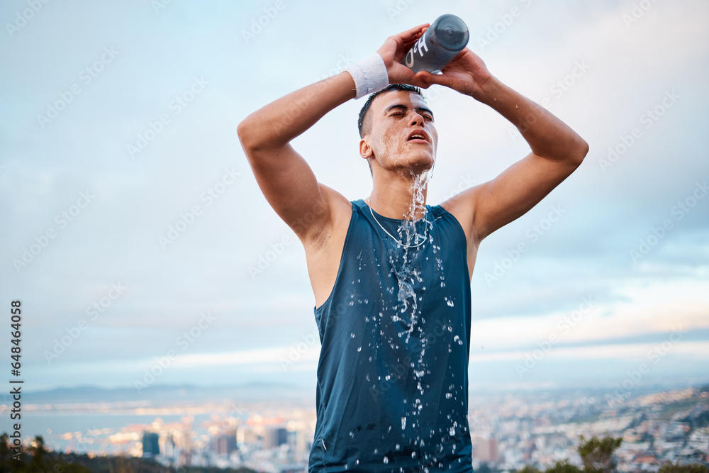 Fitness, water and fatigue with a sports man outdoor, tired after running a marathon for cardio training. Exercise, health and an exhausted young runner pouring liquid for hydration or refreshment