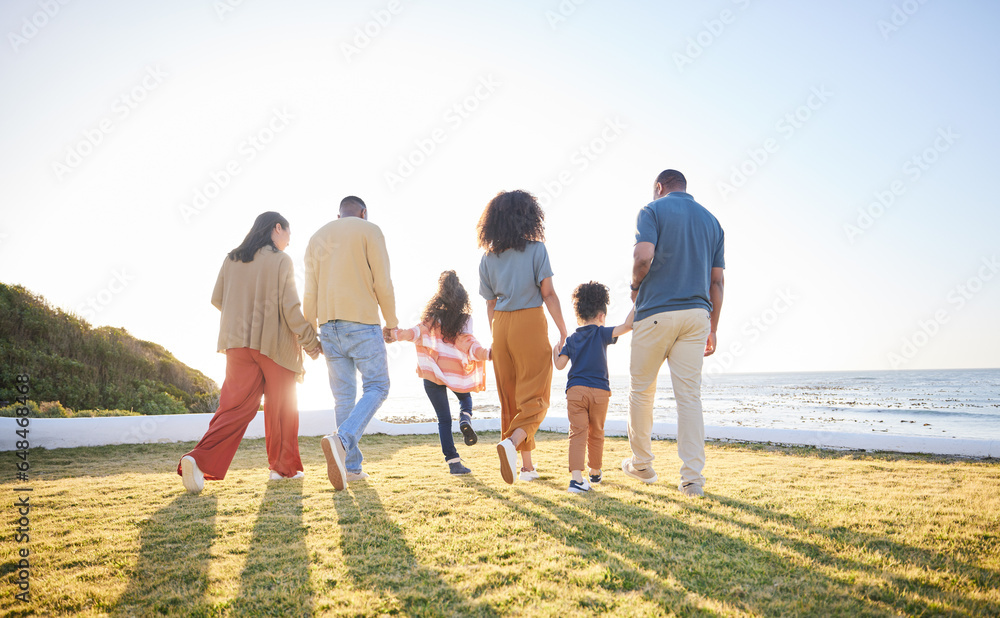 Nature, walking and back of big family holding hands, unity solidarity or bond on wellness holiday, travel or love. Sunshine flare, sky and relax kids, mom and dad support, trust and journey on grass