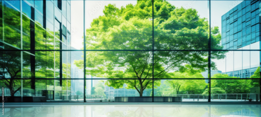 Modern building reflects nature and eco-friendly building in the city, sustainable glass building for reducing heat and carbon dioxide, Office building with a green environment, Blurred image