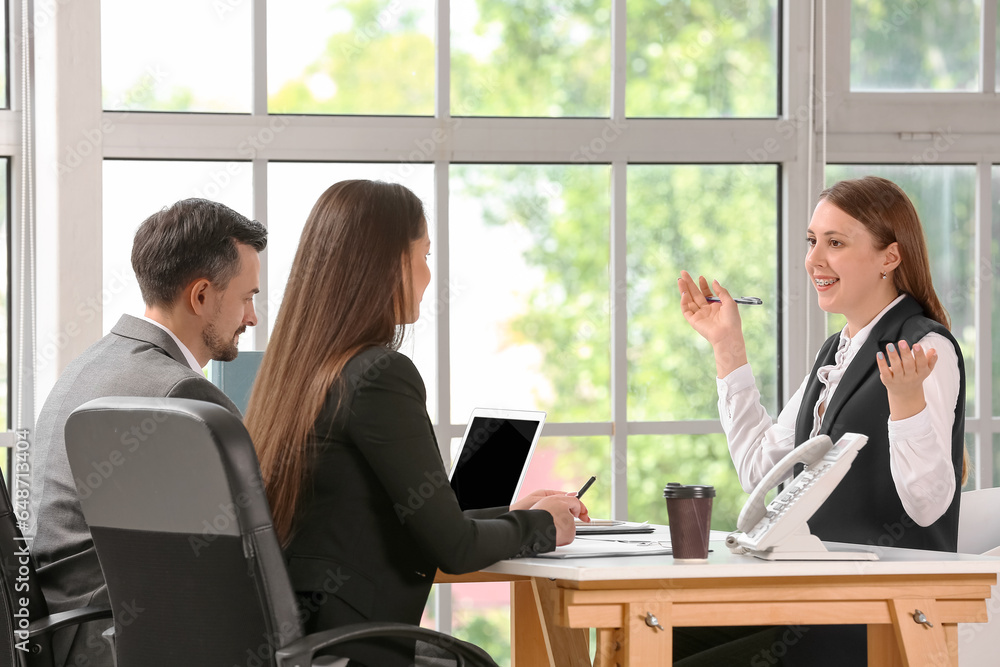 Human resources commission interviewing female applicant in office