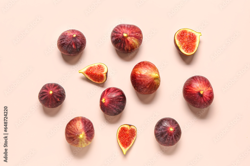 Ripe fresh figs on pale pink background