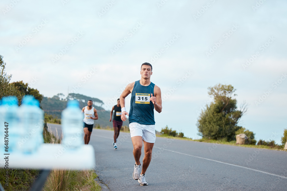 Man, fitness or running on road in marathon, healthy challenge or outdoor sports race performance. Water bottle, athlete or runner on street in workout, training or exercise for triathlon competition