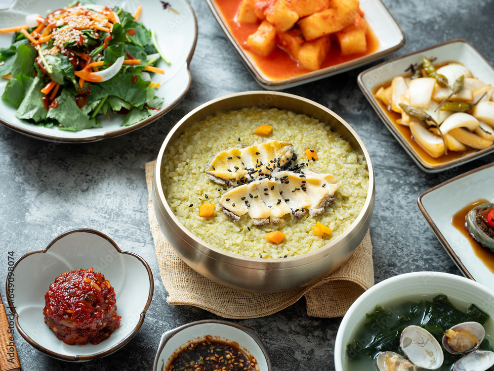 Abalone porridge, clam seaweed soup, and various side dishes	