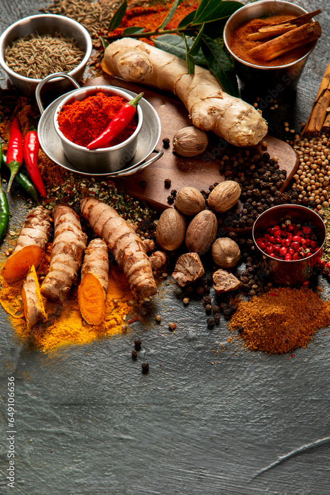 Spices on dark background. Different varius.