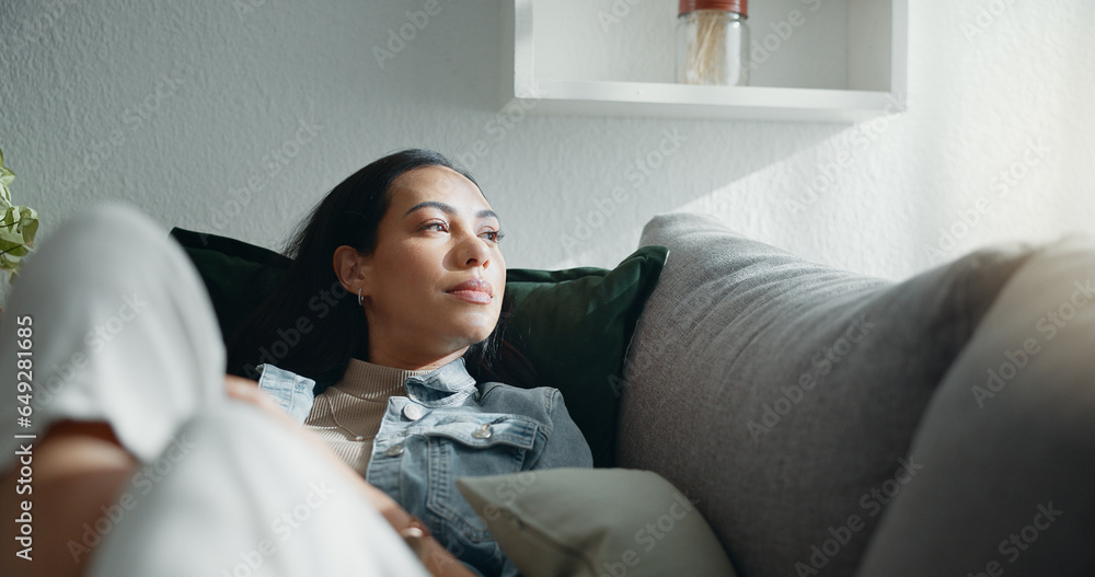 Woman, thinking and typing on smartphone on sofa, scroll social media and reading notification at home. Cellphone, relax and search connection, download digital app and mobile contact in living room