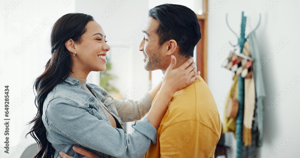 Couple, happy and hug in home lounge with a smile, security and love in healthy relationship. Young man and woman together in an apartment for affection, forehead touch and communication with care